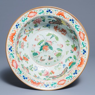 A Chinese famille rose bowl with ducks and butterflies, 19th C.