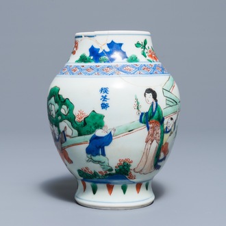 A Chinese wucai baluster vase with figures in a garden, Transitional period