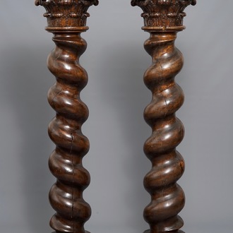 A pair of carved oak twisted pillars with Corinthian capitals, 18th C.