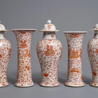 Une garniture de cinq vases en porcelaine de Chine 'lait et sang', Kangxi