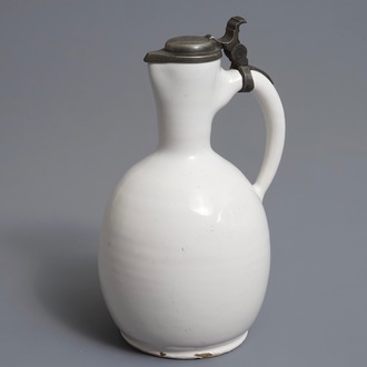 A white Dutch Delft jug with pewter cover, 17th C.