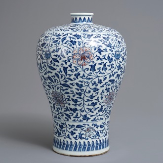 A Chinese blue, white and underglaze red 'lotus scroll' meiping vase, 19/20th C.