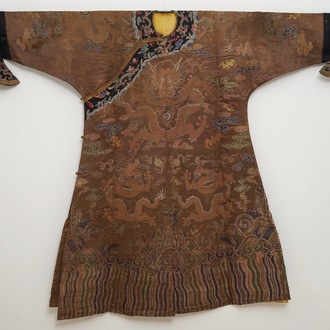 A Chinese brown ground eight-dragon embroidered silk robe, Qianlong