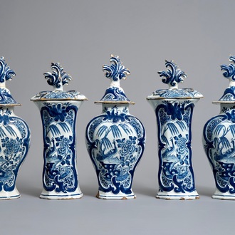 A Dutch Delft blue and white five-piece garniture with birds of paradise, 18th C.