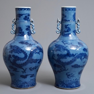 A pair of Chinese lavender blue vases with underglaze dragons, 18/19th C.