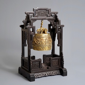 A Chinese gilt bronze bell in zitan suspension frame, Qianlong mark, 18/19th C.