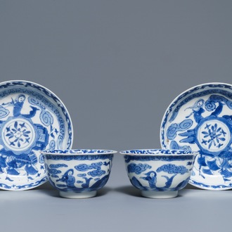 A pair of Chinese blue and white French market cups and saucers with texts, Kangxi