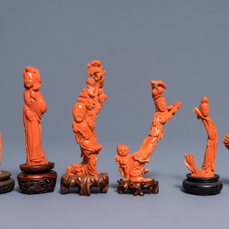 Six Chinese carved coral figures on wooden stands, 19/20th C.