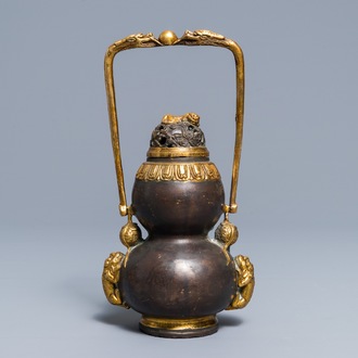 A Chinese parcel-gilt bronze double gourd hanging censer and cover, Kangxi mark, Qing