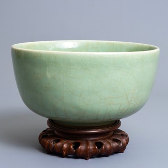 A Chinese celadon bowl on wooden stand, Kangxi/Yongzheng