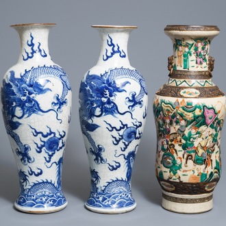 A pair of Chinese Nanking 'dragon' vases and a 'warrior' vase, 19th C.