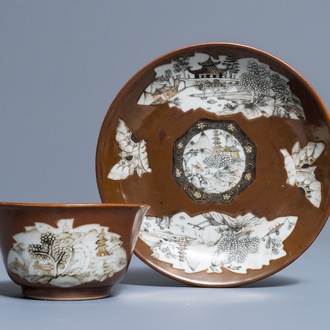 A Chinese capucin-ground grisaille and gilt cup and saucer, Qianlong