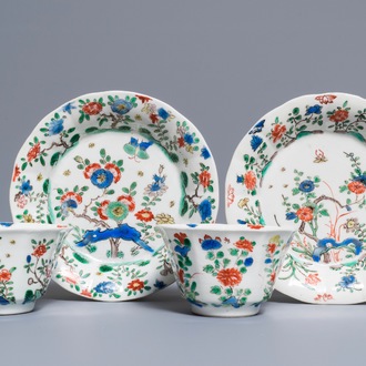 A pair of lobed Chinese famille verte cups and saucers, Kangxi