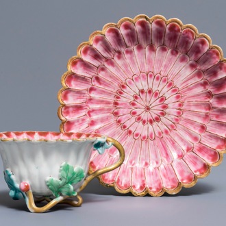 A Chinese famille rose lotus-shaped relief-decorated cup and saucer, Yongzheng