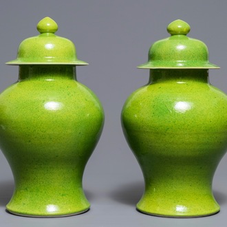 A pair of Chinese yellow and green-glazed vases and covers, 19th C.