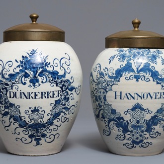 Two Dutch Delft blue and white tobacco jars with brass lids, 18th C.