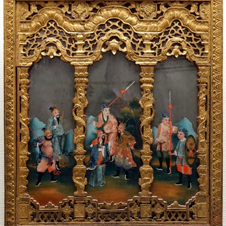 A rare Chinese gilt wood and reverse glass painted mirror, 2nd half 18th C.