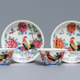 A pair of Chinese famille rose 'roosters' cups and saucers, Yongzheng/Qianlong