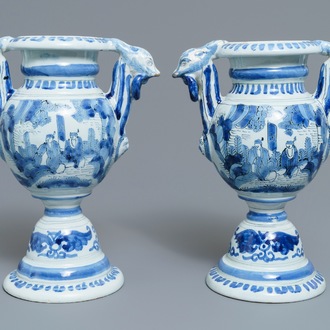 A pair of Dutch Delft blue and white chinoiserie altar vases, 17th C.