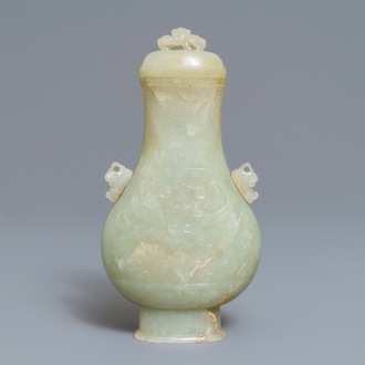 A Chinese archaic celadon jade vase and cover, 19th C.