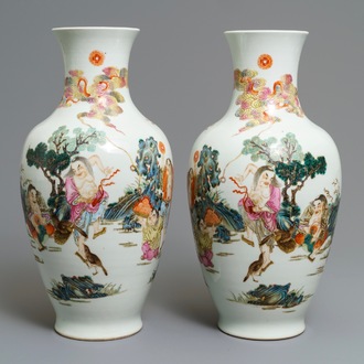 A pair of Chinese famille rose vases, Qianlong mark, 20th C.