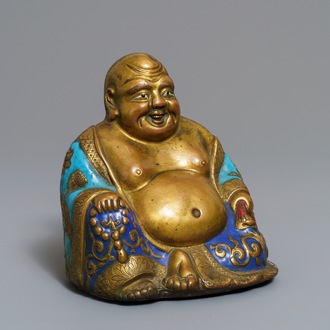 A Chinese champlevé enamelled copper figure of Buddha, Qianlong