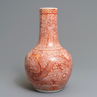 A Chinese iron red 'dragon and phoenix' bottle vase, 19th C.