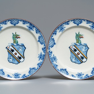 A pair of polychrome Dutch Delft plates with the arms of Webster, 18th C.