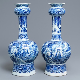 A pair of tall Dutch Delft blue and white chinoiserie vases, late 17th C.