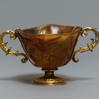 A Chinese gilt brass-mounted carved horn libation cup, 18/19th C.