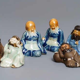 Six Chinese blue, white and celadon biscuit figures, Qianlong