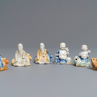 Six Chinese blue, white and celadon biscuit figures, Qianlong