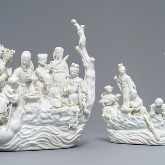 Two Chinese Dehua blanc de Chine groups with immortals on log boats, 19th C.