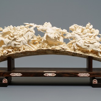 A Chinese carved ivory group with warriors on horseback, 2nd quarter 20th C.