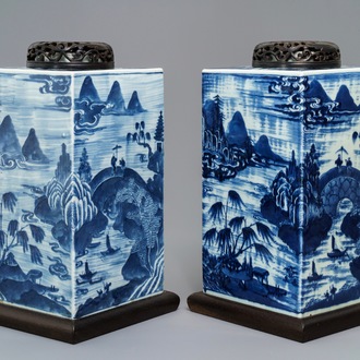 A pair of tall Chinese blue and white tea caddies with landscapes, 19th C.