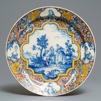 A Dutch Delft polychrome mixed technique romantic scene dish, 18th C.