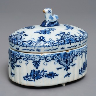 A Dutch Delft blue and white sheep-finial butter tub, 18th C.