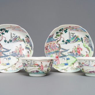 A pair of Chinese famille rose cups and saucers with figures in a landscape, Yongzheng