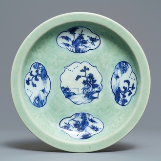 A Chinese celadon-ground dish with blue and white landscape medallions, 18/19th C.