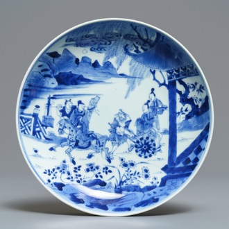 A Chinese blue and white plate with figures in a garden, Yongzheng