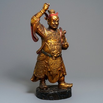 A large Chinese carved giltwood figure of a guardian, 17/18th C.