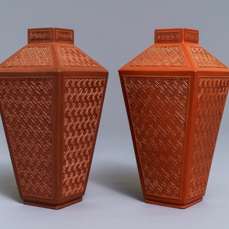 A pair of Chinese Yixing stoneware relief-decorated tea caddies, seal mark, 18th C.