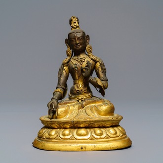 A Sino-Tibetan inlaid gilt copper alloy figure of a White Tara, 18/19th C.