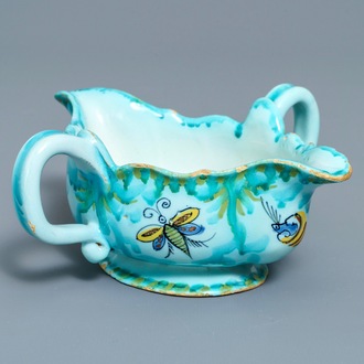 A Brussels faience sauce boat with butterflies and caterpillars, late 18th C.