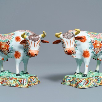 A pair of polychrome petit feu and gilded Dutch Delft models of cows, 1st half 18th C.