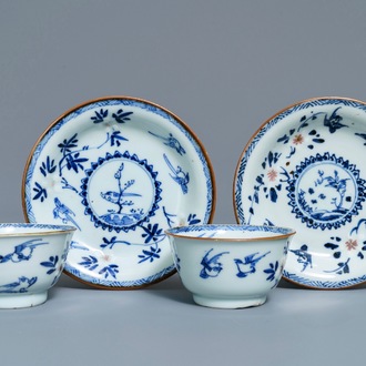 A pair of Chinese blue, white and underglaze red cups and saucers, Kangxi