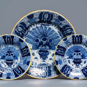 A Dutch Delft blue and white 'peacock's tail' dish and a pair of plates, 18th C.