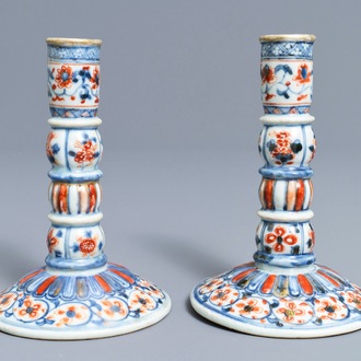 A pair of Chinese Imari-style candlesticks after European silver models, Kangxi