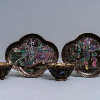 A pair of Chinese silver and lac burgaute quatrefoil cups and saucers, Kangxi