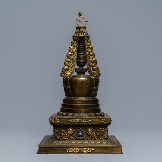 A large parcel-gilt inlaid bronze stupa, Tibet, 18th C.